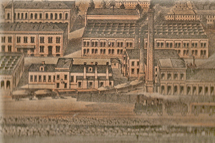 Part of Jönköpings Tändsticksfabrik AB in the 1870s. The single-story building in the foreground is now the matchstick museum. Lithograph.