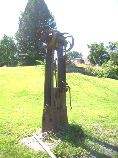 All that remains is a solitary drop hammer on the now deserted factory grounds. Photo by the author.